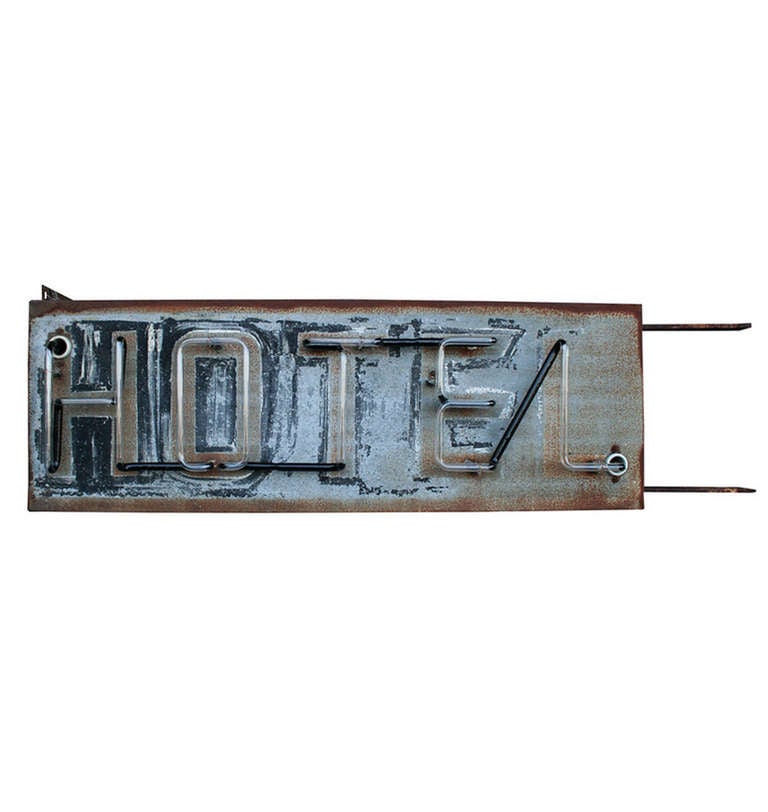 Your guests will feel right at home when they enter below this incredible and perfectly worn neon HOTEL sign. Can be mounted from the bracket at the top or the two arms on the side. The original paint and construction are all in place, but we've