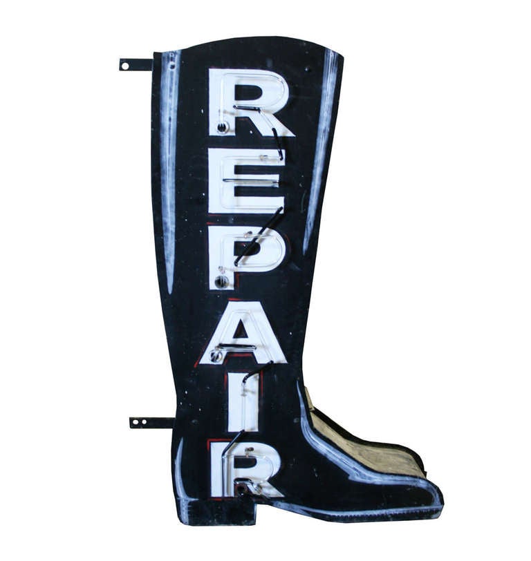 What's not to love about this magnificent five and half foot tall Boot Repair sign? It features hand-painted lettering and shadowing, a fantastic boot shape, complete with heel and rounded toe, and boasts fully restored, bright red double-sided