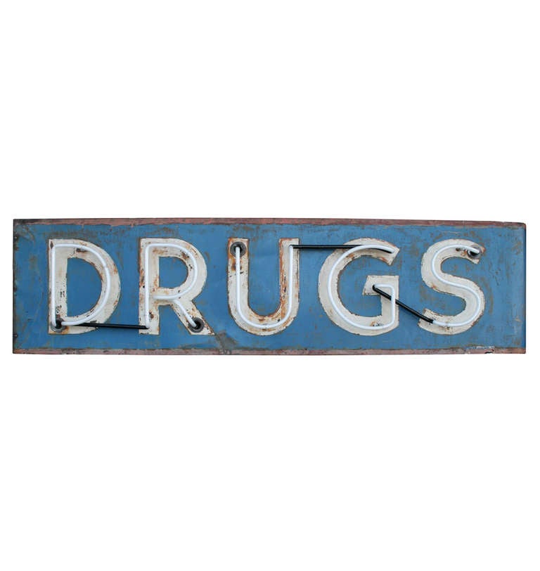 It's easy to imagine this blue and white beauty mounted at the entrance to a busy city drug store. We've added a set of eye-hooks to make it easy to mount this to a beam or directly to the ceiling, but we think it makes quite a statement perched on