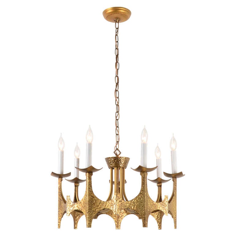 This chandelier is a fine example of a trend wihin a trend within a trend. The streamlined Modernism of the 1950s and '60s produced a more ornamental and experimental version of itself called the Contemporary style in the late 1960s and 1970s. A