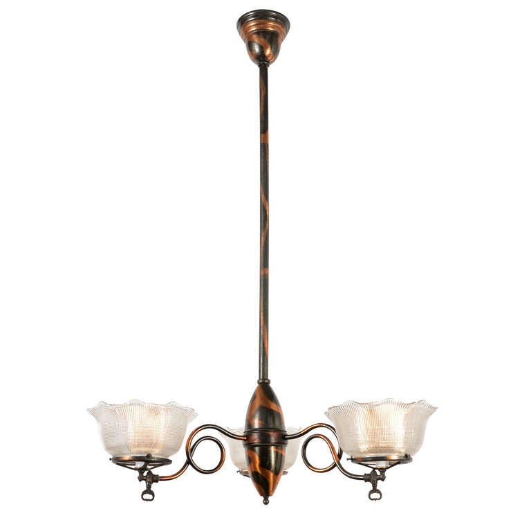 The restrained simplicity of this classic vernacular 3-arm gas fixture lets other features shine - like the outstanding original mottled or oxidized copper finish and the quirky and expressive bent brass arms. Superbly fitted with unmarked (but