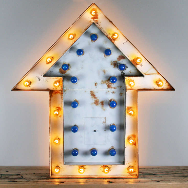 Bask in the warm and wonderful glow of this four foot tall salvaged carnival sign. This incredible piece features 62 flashing lights (31 on either side) and has been outfitted with an updated dimmer, which allows you to completely control the level