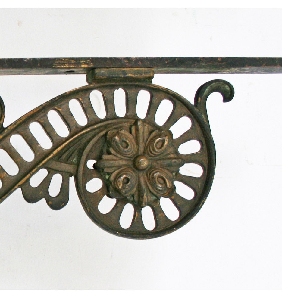 Originally used to support an entry portico, these enormous cast bronze Victorian brackets are as functional as they are beautiful. Imagine them, combined with a piece of reclaimed lumber, on either side of your fireplace. Or as the brackets for a