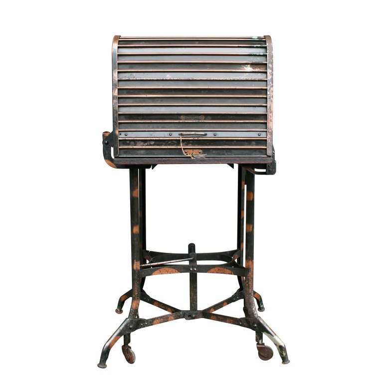 Produced in Toledo, Ohio, factory and commercial furniture became the bread and butter of the Uhl Art Steel Company from the turn of the 20th century through the 1950's. With a turn of the key, the top rolls back, revealing a fully-functional,