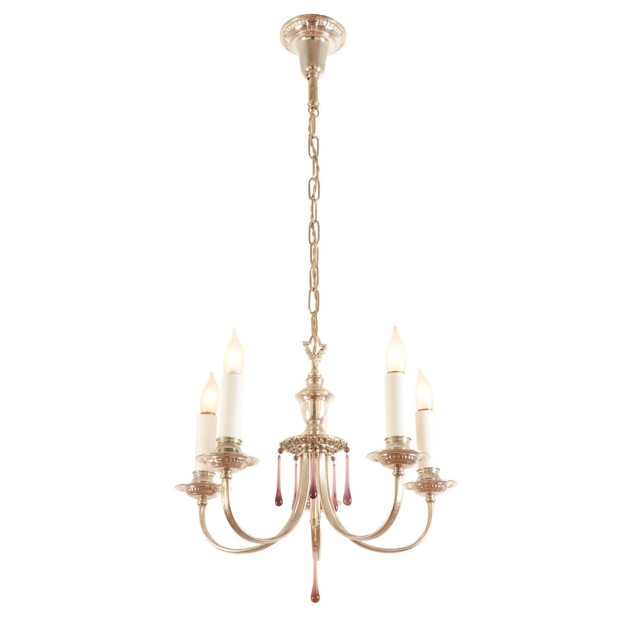 Colonial Revival Chandeliers were so plentiful and so many variations sprung from that style, that when a unique iteration comes into our collection, we have to share it. The details of this piece really make it stand out: the silver-plated finish,