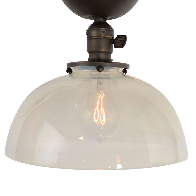 Large and simple multi-arm fixtures using carbon-filament light bulbs like this one were extremely common in commercial and institutional settings between 1900 and 1910 - but most were replaced in the decades that followed the introduction of the