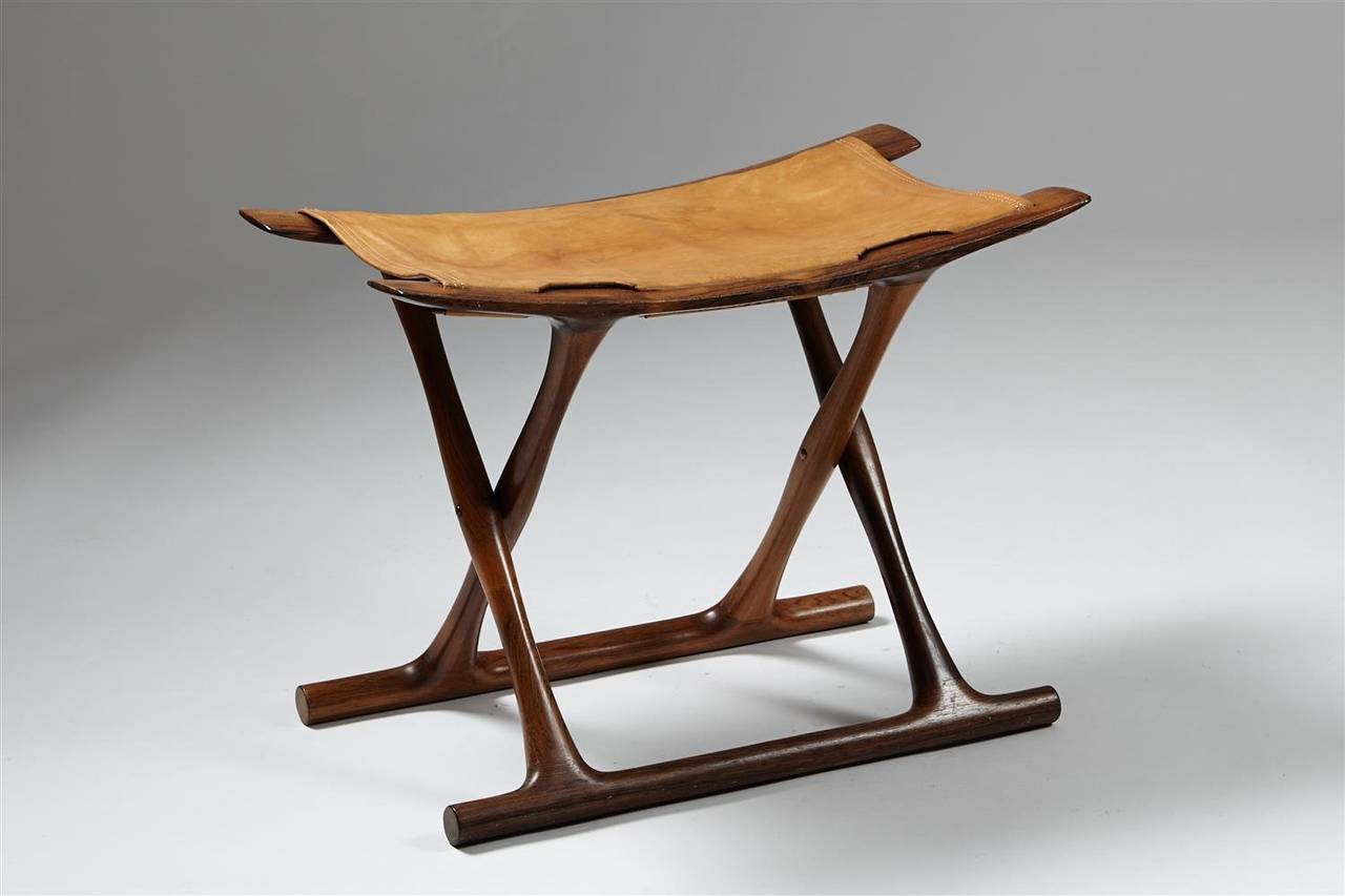 Egyptian stool designed by Ole Wanscher for AJ Iversen, Denmark. 1957.
Solid rosewood and original cognac leather.