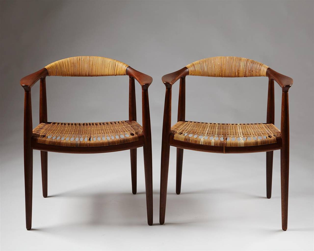 Armchair “The Chair” designed by Hans Wegner for Johannes Hansen, Denmark, 1949.
Teak and cane.
Early model with the caned backrest.
2 available