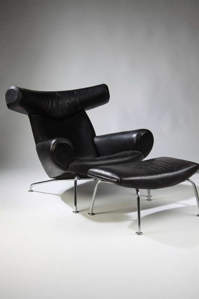 Armchair with footstool, The Ox. designed by Hans Wegner, manufactured by Johannes Hansen, Denmark, 1970s.