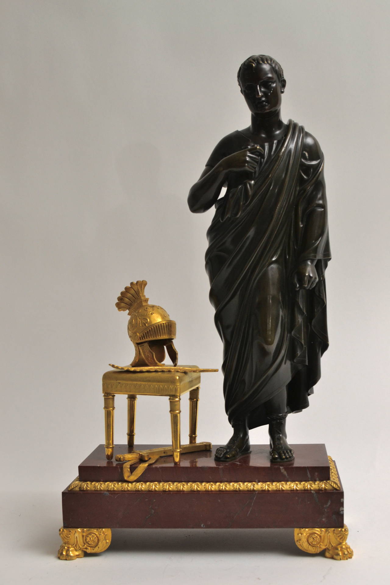 An empire gilt bronze and patinated sculpture of Caesar on a red marble base. Early 19th century, France.