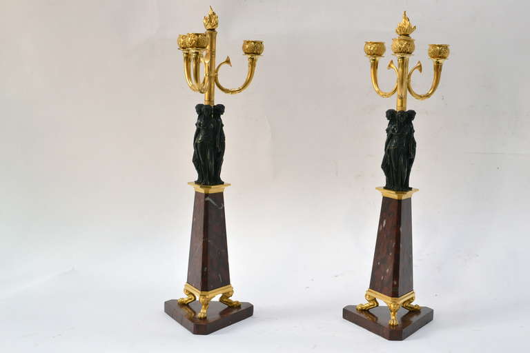 Pair of gilt bronze candelabra on a red marble base attributed to Vulliamy & Son in London, probably circa 1805.