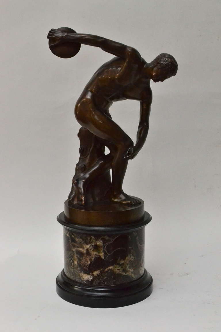A 19th century bronze sculpture copy of the famous Diskobolos. This bronze is attributed to Benedetto Boschetti (1820-1860).  On a red Levanto marble base. The Diskobolus of Myron (