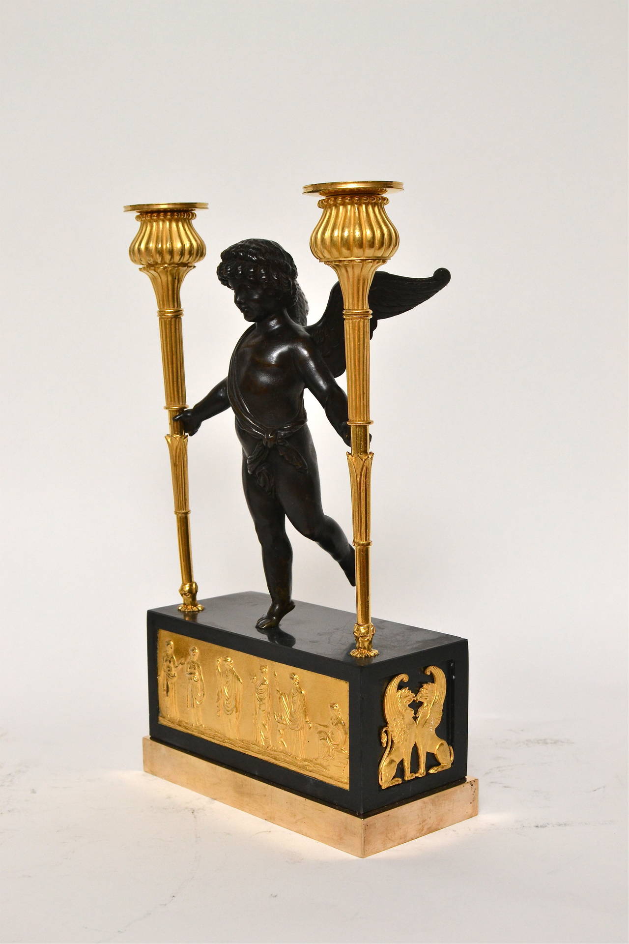 A pair of unusual Empire gilt bronze and black marble candelabra, possibly English, circa 1825.