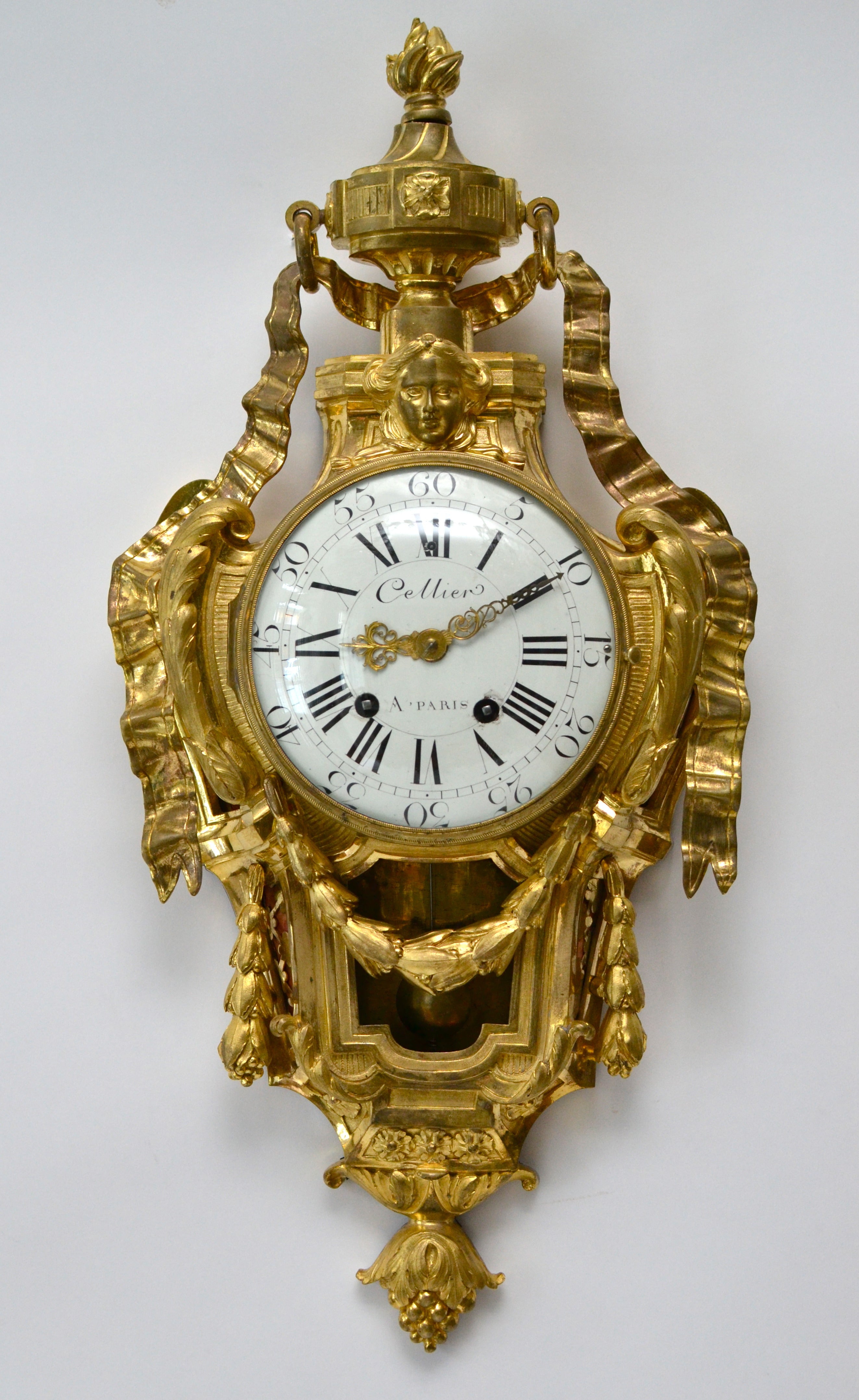 A Louis XVI gilt bronze wall clock signed "CELLIER A PARIS", 18th century.