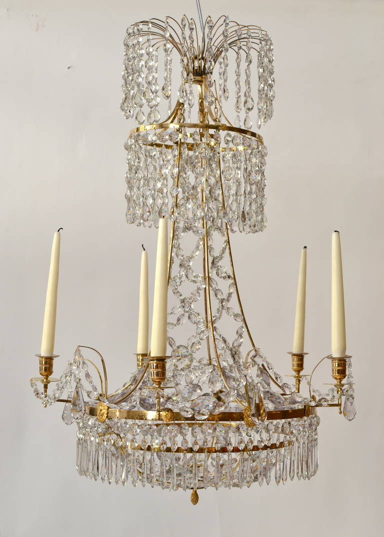 A Gustavian chandelier of an unusual model made in the late 18th century. Gilt bronze and crystals. The quality is very high and it's in a very good condition.