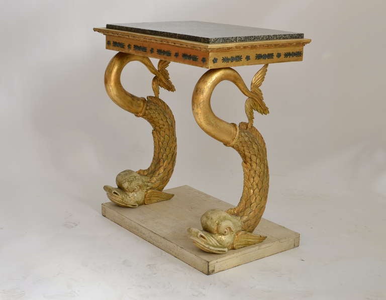 A fine Swedish carved giltwood console table made circa 1820 by Petter Gustaf Bylander (1777-1859). Not signed. Most of the gilding is original. The Swedish “Åsby Diabas” marble top is a close relative to the Swedish porphyry, a very hard and