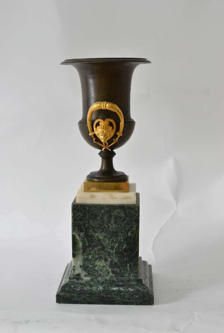 Pair of Empire Gilt and Patinated Bronze Urns on Marble Bases In Good Condition In Stockholm, SE
