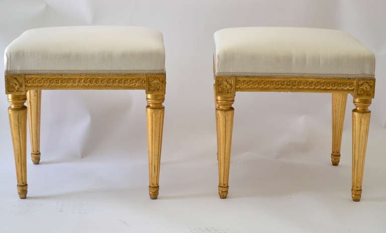 A fine pair of gustavian giltwood stools made in Stockholm circa 1780-90.