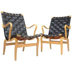 A pair of Eva chairs in leather, by Bruno Mathsson for Karl Mathsson, Sweden