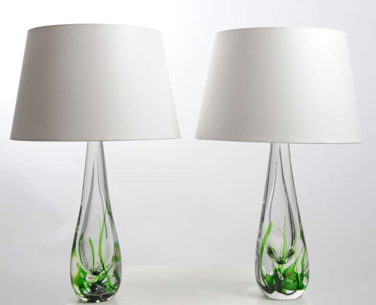 A pair of table lamps designed by Vicke Lindstrand for Kosta, Sweden.

Measures: 40 cm high without shades, 57cm high with shades.