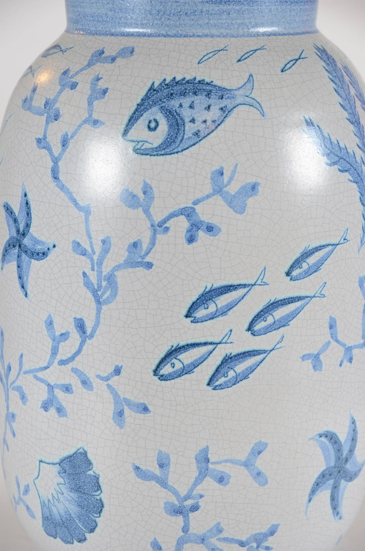 Urn in blue glazed ceramic/faience, fish motif. Height 80 cm / 31,5 inches. 
Designed by Eva Jancke-Björk (1882-1981), Bo Fajans, Gefle, Sweden, 1930´s.