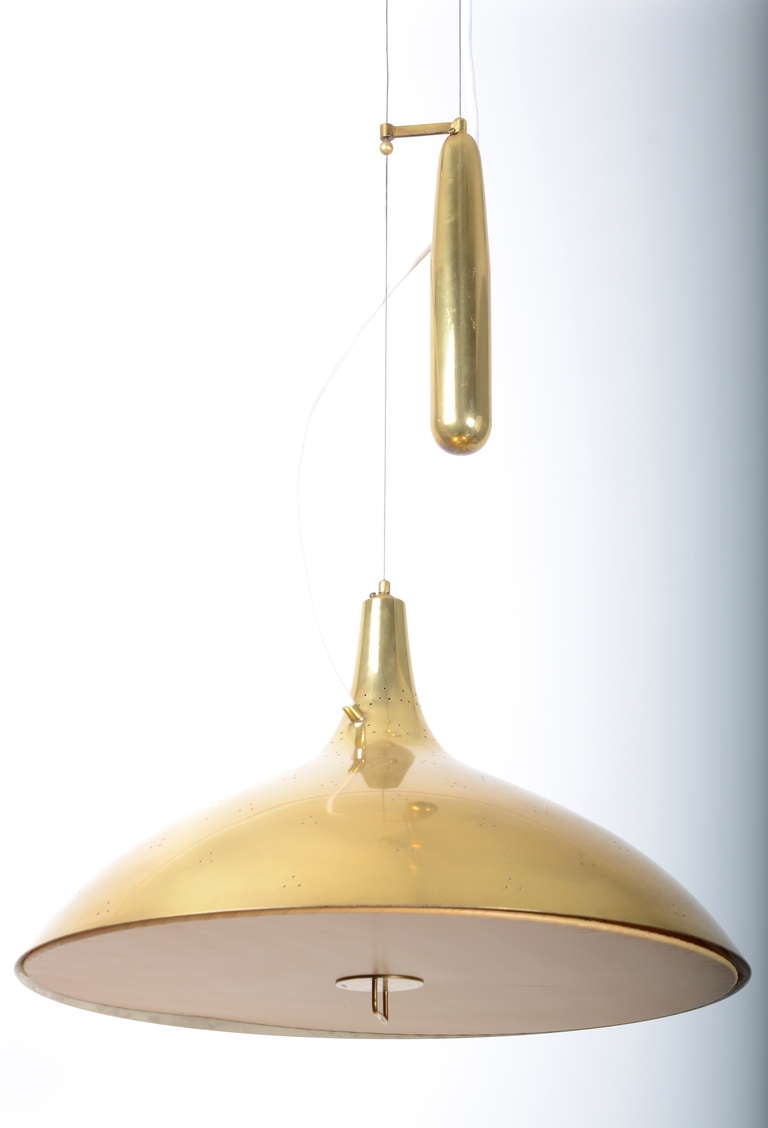 Brass Pendant designed by Paavo Tynell for Taito Oy, Finland, 1948. 

Perforated brass, original silk diffuser 
The height is adjustable.