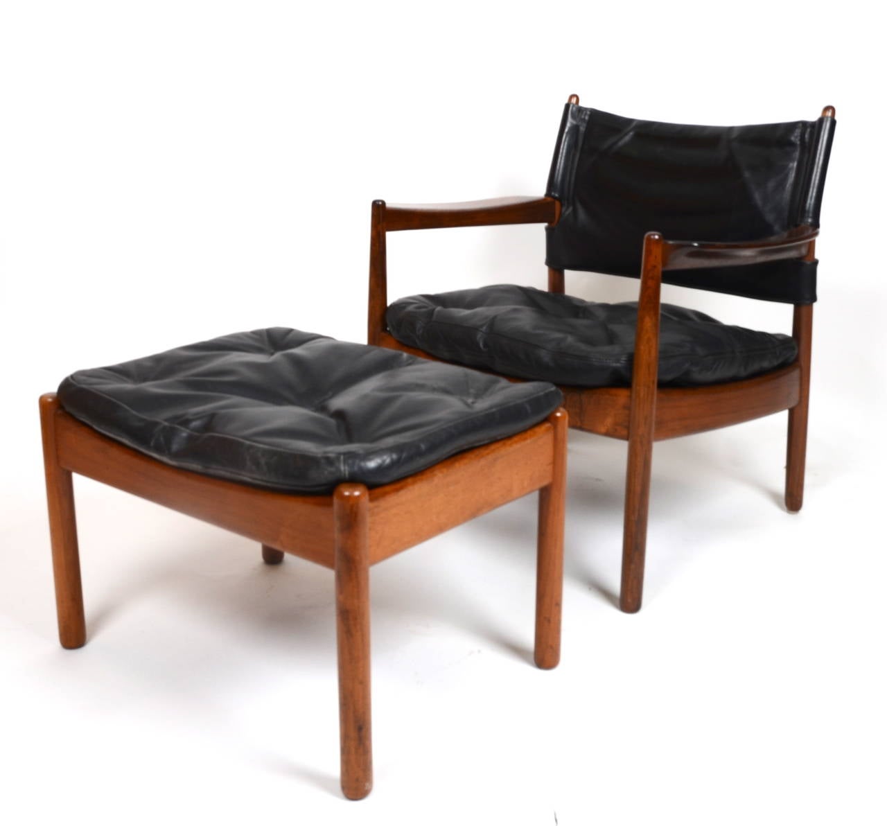Armchair and stool in wood and leather. Designed by Gunnar Myrstrand for Källemo. Sweden, 1960´s.