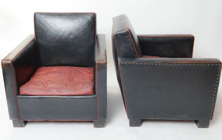 Club chairs designed by Björn Trägårdh (1908-1998) for Svenskt Tenn, Sweden. 

Leather with a rich and beautiful patina. Metal rivets.