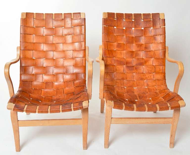 A pair of Bruno Mathsson Eva chairs with a lot of patina.