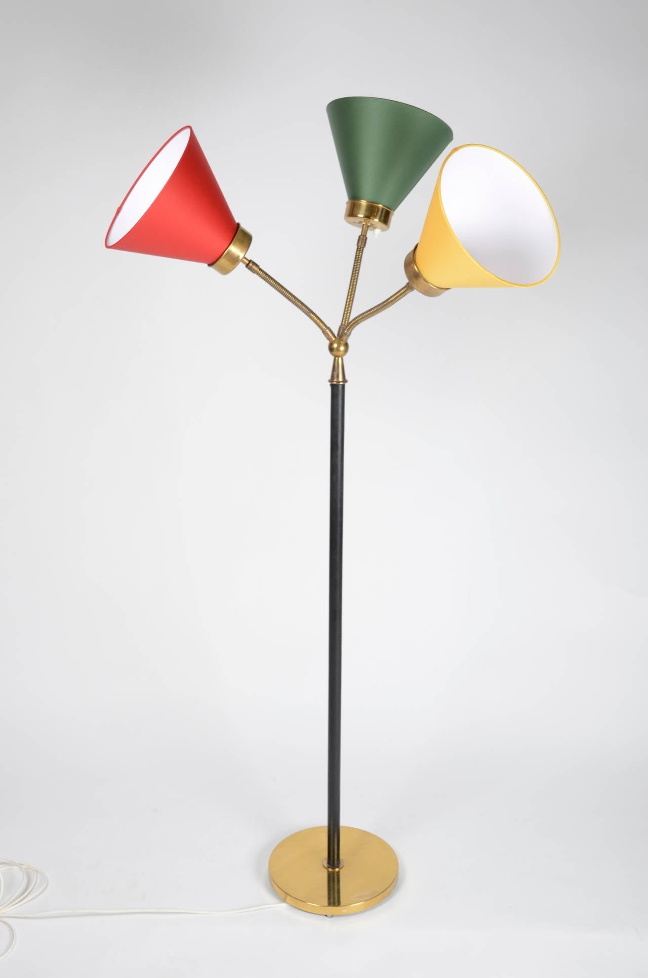 Floor lamp in brass and leather, model 2431, also called the San Fransisco-lamp, designed by Josef Frank in 1938 for Firma Svenskt Tenn. Shown at the Golden Gate exhibition in 1939. With three new lampshades, model 1842, Firma Svenskt Tenn.