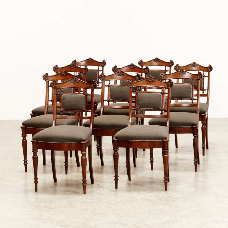 A collection of 10 danish late empire dining chairs in Cuban mahogany. Elegant crafted with several woodcut details on top of back and turned front legs. 'Hetch style'. Copenhagen, 1820-40. Sold all together.