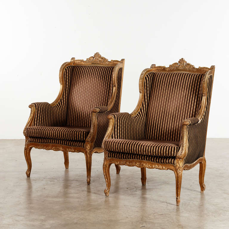 Pair of french 'Wing chairs' - woodcut, gesso and gilded. Time has given the gild a softened look, which enhances the patina. France, 1860-80.Sold as a pair.