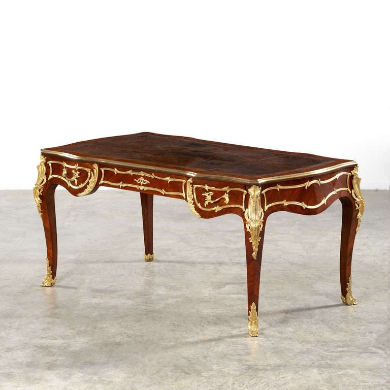 French desk - beautifully and elegantly made. Walnut veneer with gilt bronze mounts, the tabletop with leather, Napoleon III, 1860-1880. Splendid table.