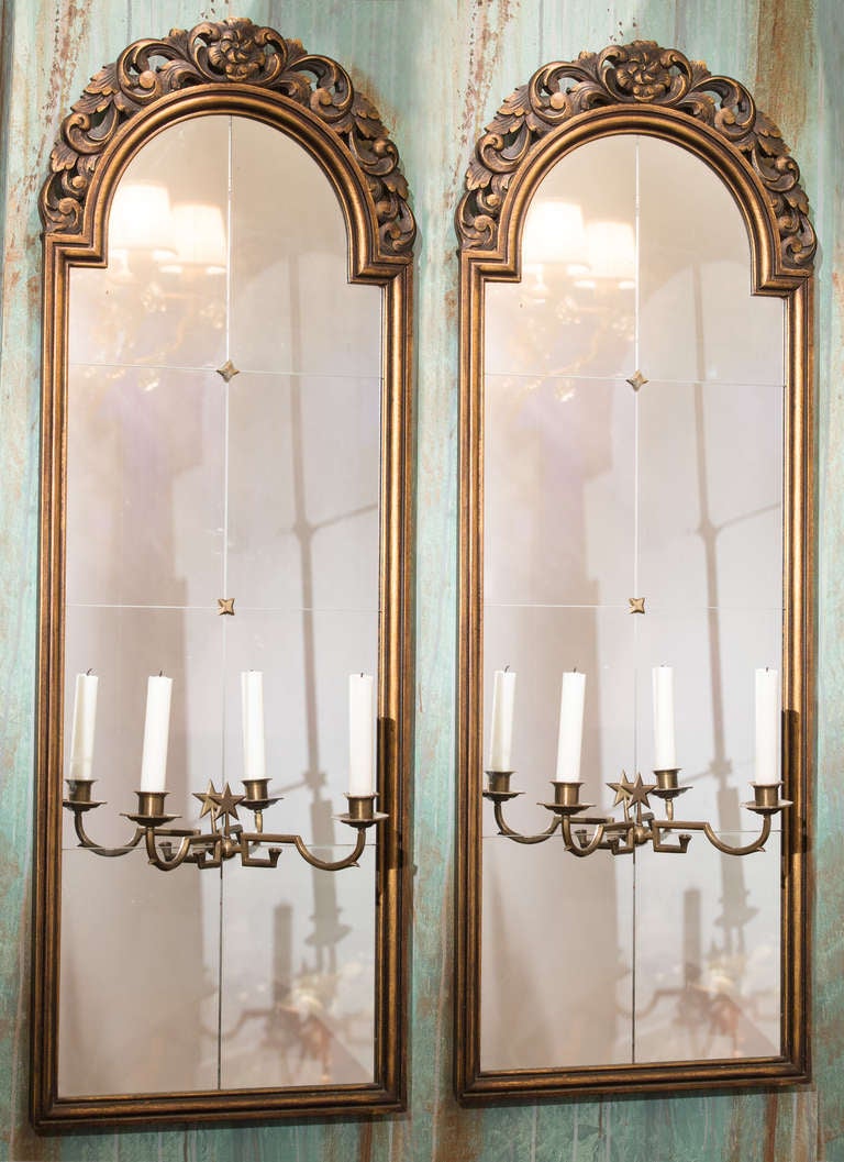 Swedish 1920's (from the Swedish Grace period) pair of Mirrors with adjustable candleholders. The width of the candleholders can be adjusted.