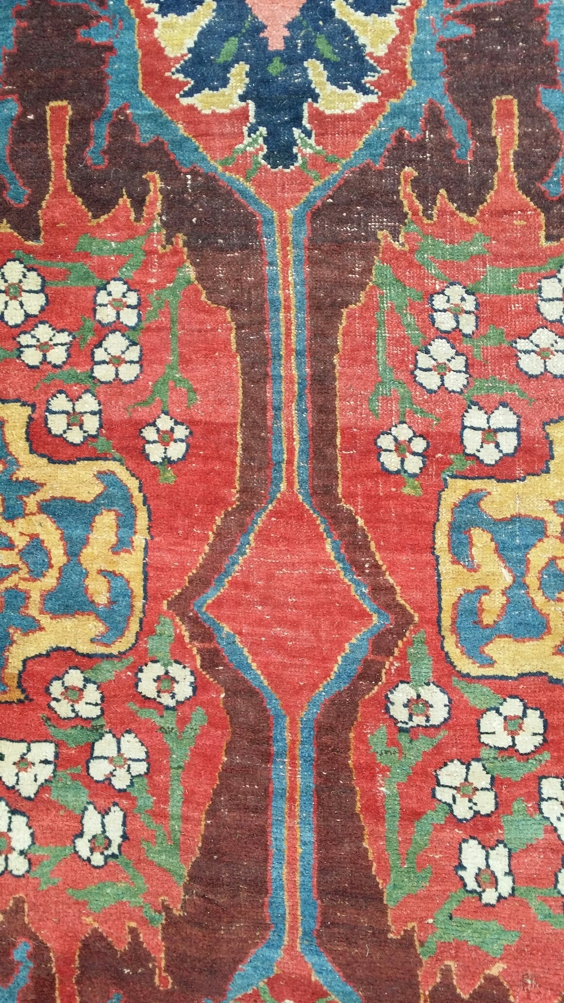 Bijâr NW. Persia . Kurdistan . Probably woven on commission from the workshop in Garus. Pattern : Abrashed red field with large arabesques , polygons and small flowers. Wool warps: ivory, Z2S plied , c. 60 degree depress . Pile: wool,Z2 spun,
