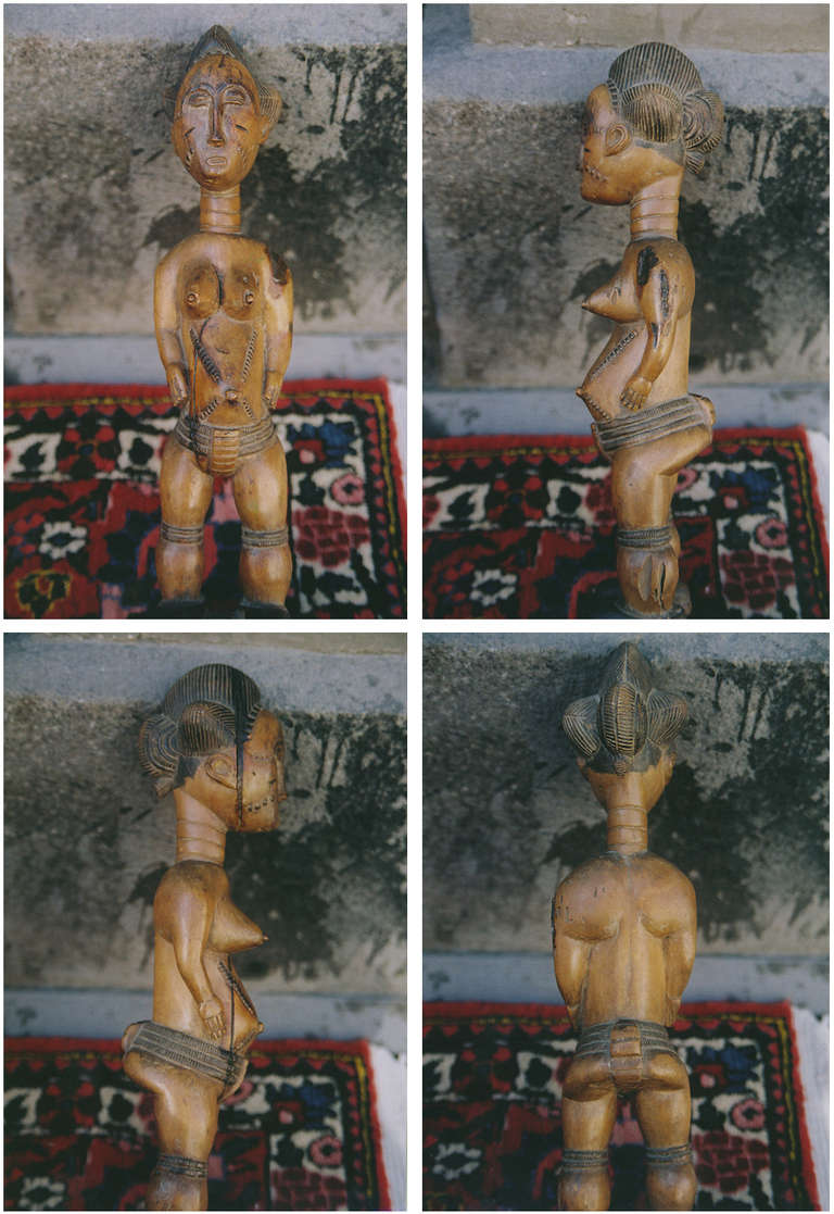 Baulé female figure from S.C. Ivory Coast. Unusually light wood with honey-brown patina. Black pigment on coiffure, loin-cloth and footwear. A finely carved, old sculpture. Provenance: Private collection in Denmark. Condition: Some old termite