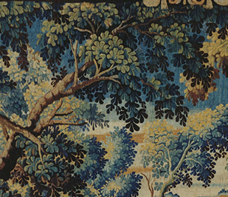 Verdure tapestry with a design of trees, shrubs plus some hills and valleys in the background.