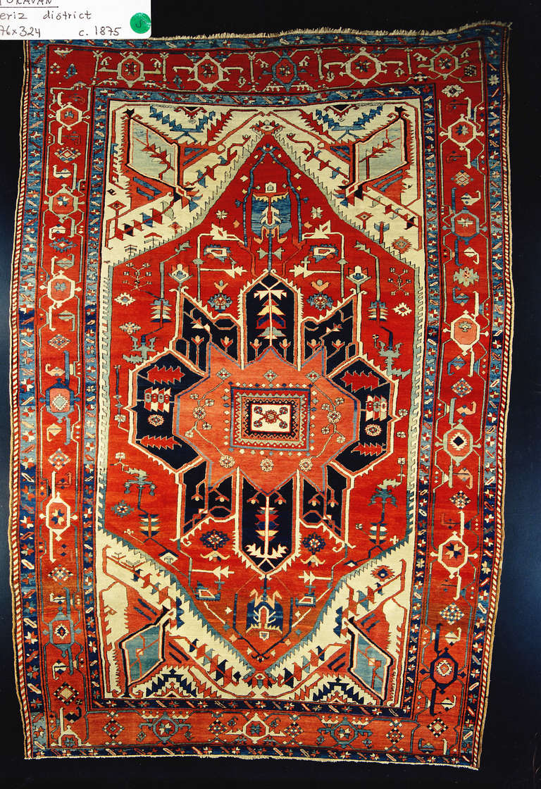 Midnight blue angular medallion against a warm red field.
Goravan is one of the villages belonging to the Heriz district in NW Persia.This is the earliest rug we have from this area