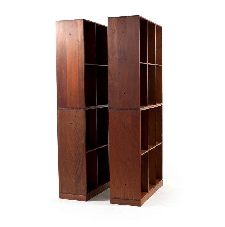 Mogens Koch library book cases in teak consisting of four units. 

The book cases was designed by Mogens Koch for his own home in 1932 and can be placed at the floor using the plinths or hung at the wall. 

Very fine original condition,