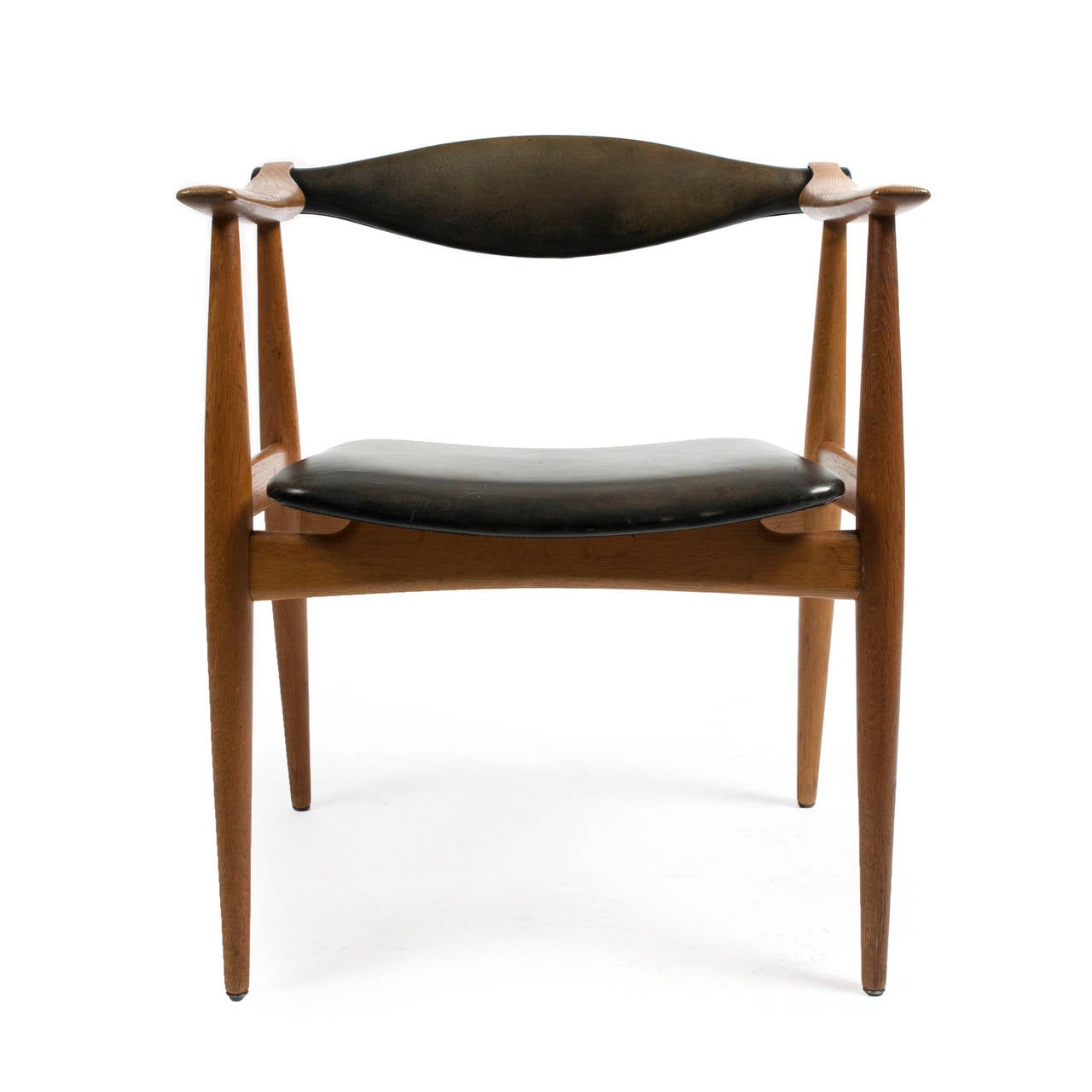 A set of four Hans J. Wegner oak dining chairs with adjustable back, upholstered with original black-dyed natural leather. 

Designed by Hans J. Wegner 1959 and made by Carl Hansen & Son, Denmark.

Beautiful original condition.