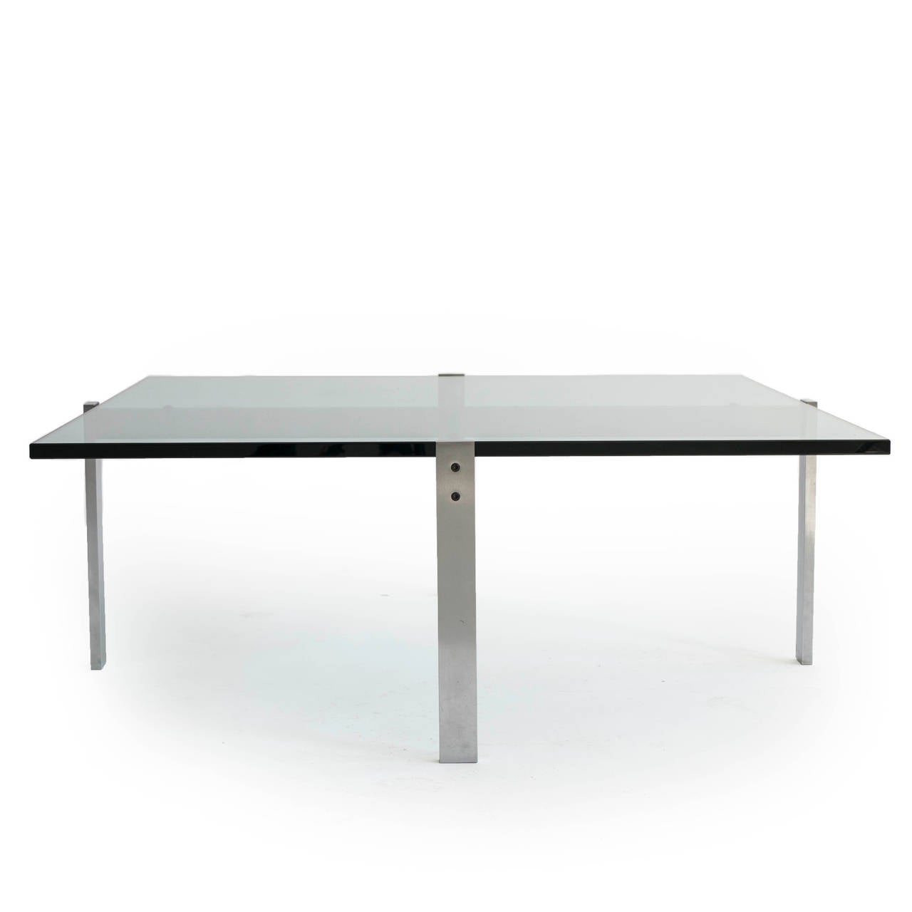 Poul Kjærholm PK65 coffee table with frame of chromed steel and top of clear glass. 

Designed by Poul Kjaerholm, 1979 and manufactured by E. Kold Christensen. Copy of original invoice included. 

Fine condition.