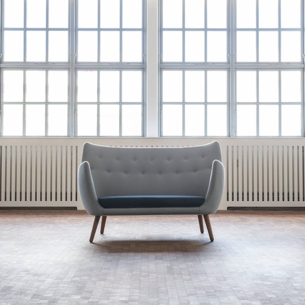 Rare Finn Juhl 'The Poet' sofa upholstered with two-tone blue fabric. Legs of stained beech. 

Designed by Finn Juhl 1941, manufactured by cabinetmaker Niels Vodder. 

For additional photos and photo of the piece in original condition please