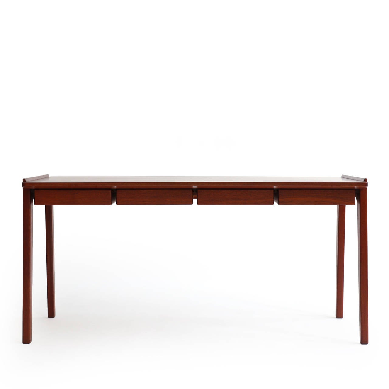 Freestanding teak desk designed by Tove & Edvard Kindt-Larsen, executed by cabinetmaker Torald Madsen. 

Mounted on tapering legs, four front drawers and top with raised edge. 

A beautiful and simple piece of very high quality.

Marked with
