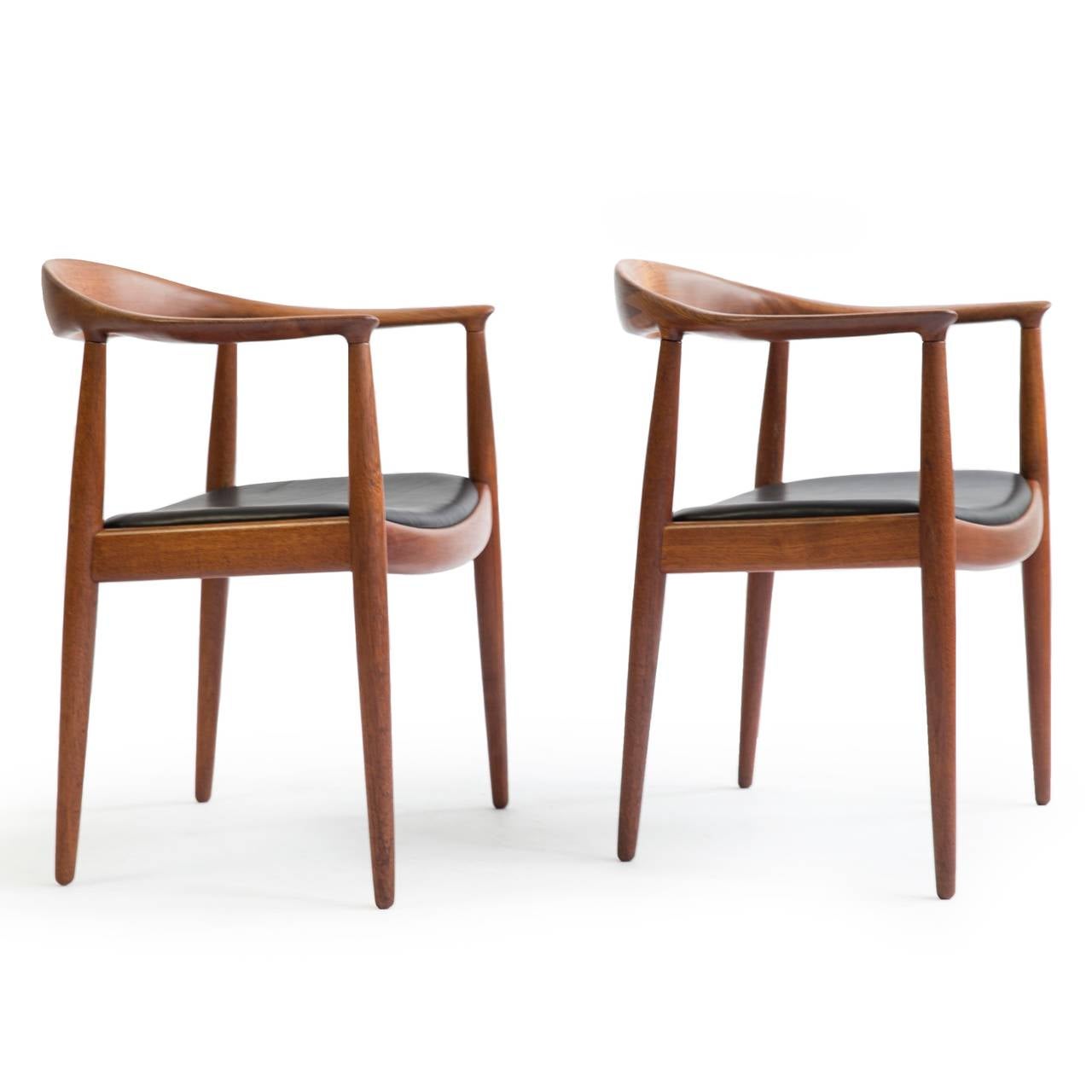 A pair of Hans J. Wegner 'The chairs' with teak frame and black leather seats. 

Designed by Hans Wegner 1949, manufactured and burn marked by Cabm. Johannes Hansen, Denmark, model JH503.

Beautiful condition.