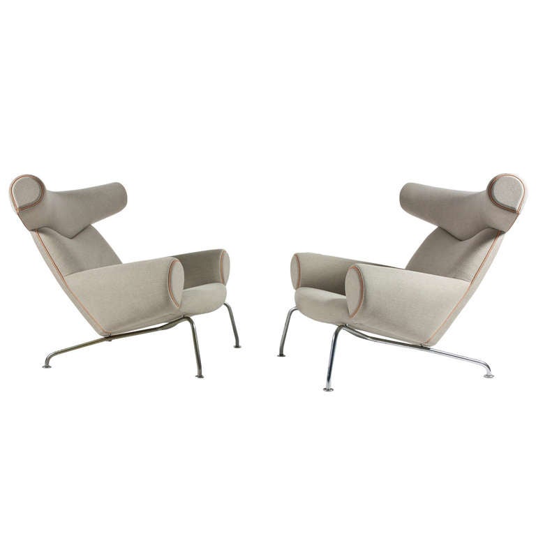 A pair of Hans J. Wegner Ox-chairs with stool.

First edition AP Stolen, Denmark 1960s, model AP46 and AP49. 

Frame of matt chromium-plated tubular steel, upholstered with new canvas and natural leather pipings.  

A rare and very comfortable