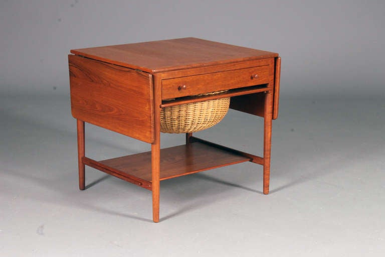 Sewing table by Hans J. Wegner for Andreas Tuck.
Model: AT-33
Design 1959
Solid Teak & wicker.
Nice vintage condition.