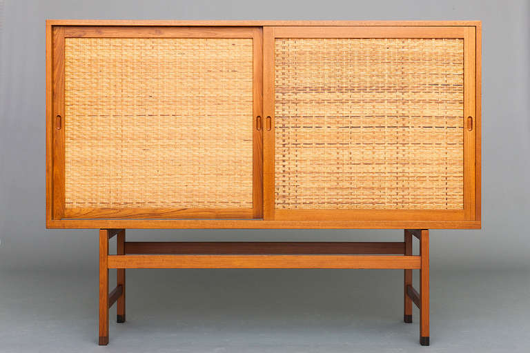 Cabinet by Hans J. Wegner for Ry Furniture.  Teak & cane.  Nice vintage condition.  Rare.