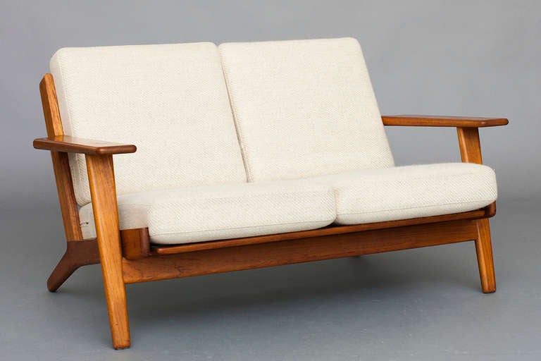 Sofa, 2-seater by Hans J. Wegner for Getama.
Model: GE 290
Teak, cushions with wool upholstery.
Nice used condition.