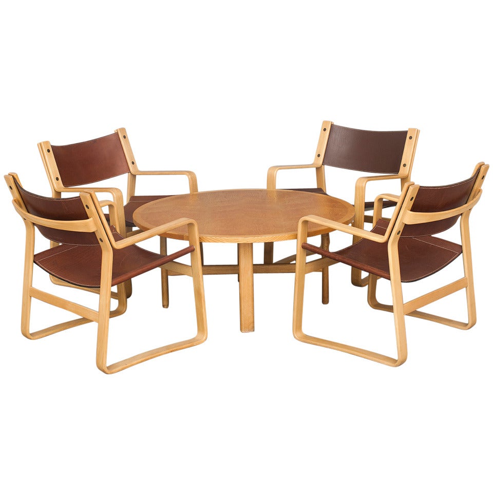 Set of Four Lounge Chairs and Coffee Table by Hans J. Wegner for Johannes Hansen.