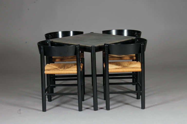 Set of 4 chairs & table by Mogens Lassen for Fritz Hansen.
Black lacquered wood & paper cord.
Nice vintage condition.